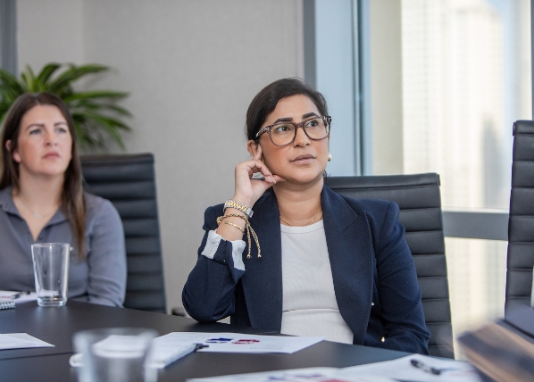 Leadership coaching workshop with professional listening during training session.