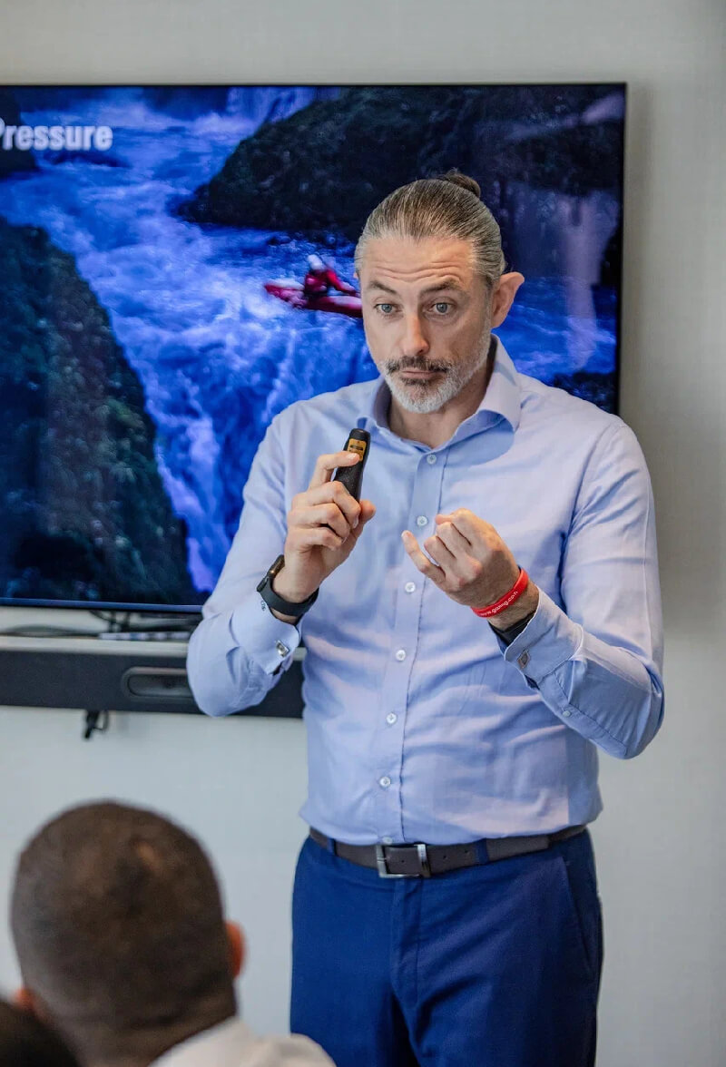 Group workshop at Ignite Training with laptops and discussion around the table.