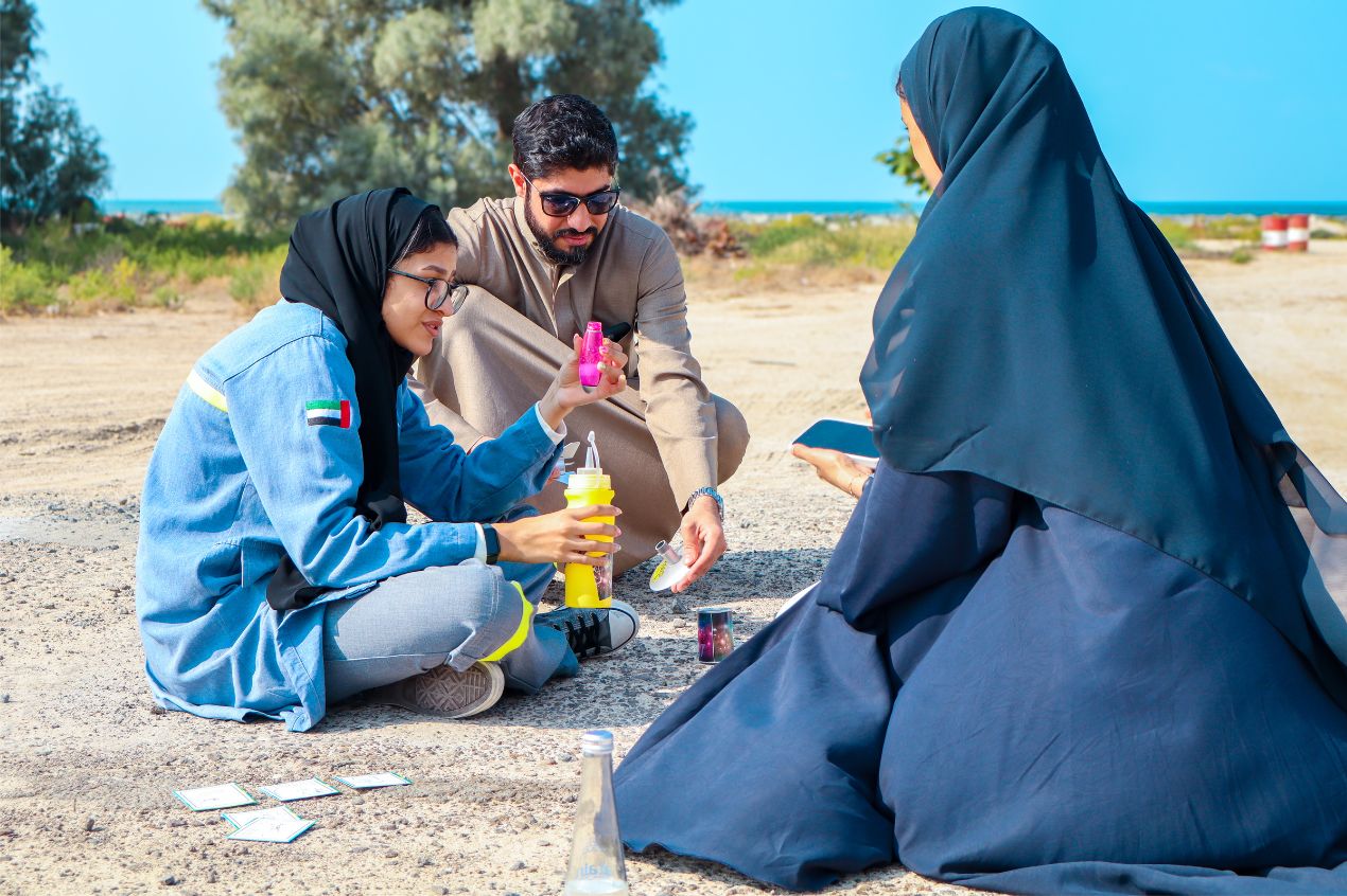 programme participants collaborating on a hands-on science challenge during training.