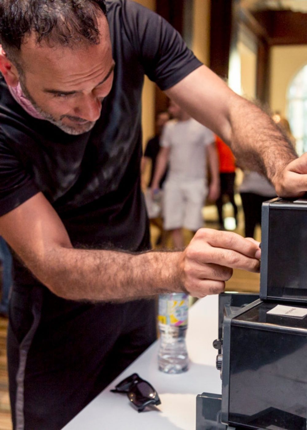 Participant completing an indoor
lockbox challenge during a corporate team building session.